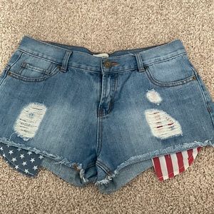 Denim shorts with American flag pockets